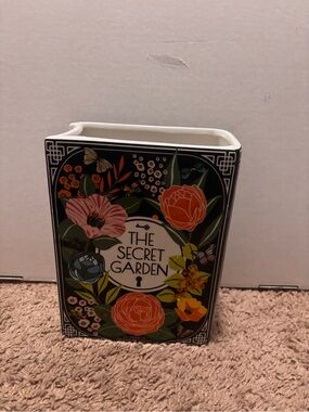 The Secret Garden book shaped vase with floral illustrations and butterflies